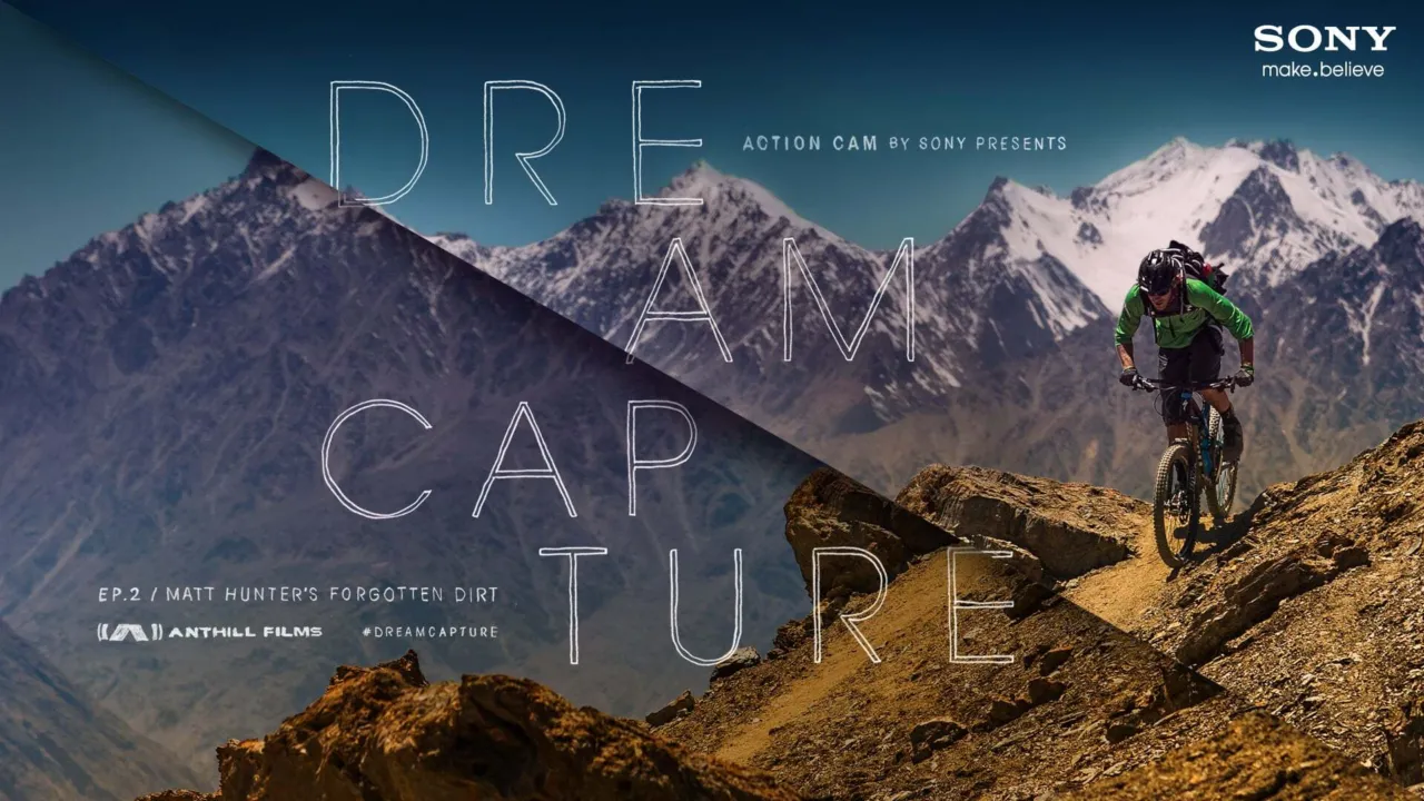 Poster image for Forgotten Dirt shows Matt Hunter riding a narrow ridge trail in the remote mountains of Afghanistan.
