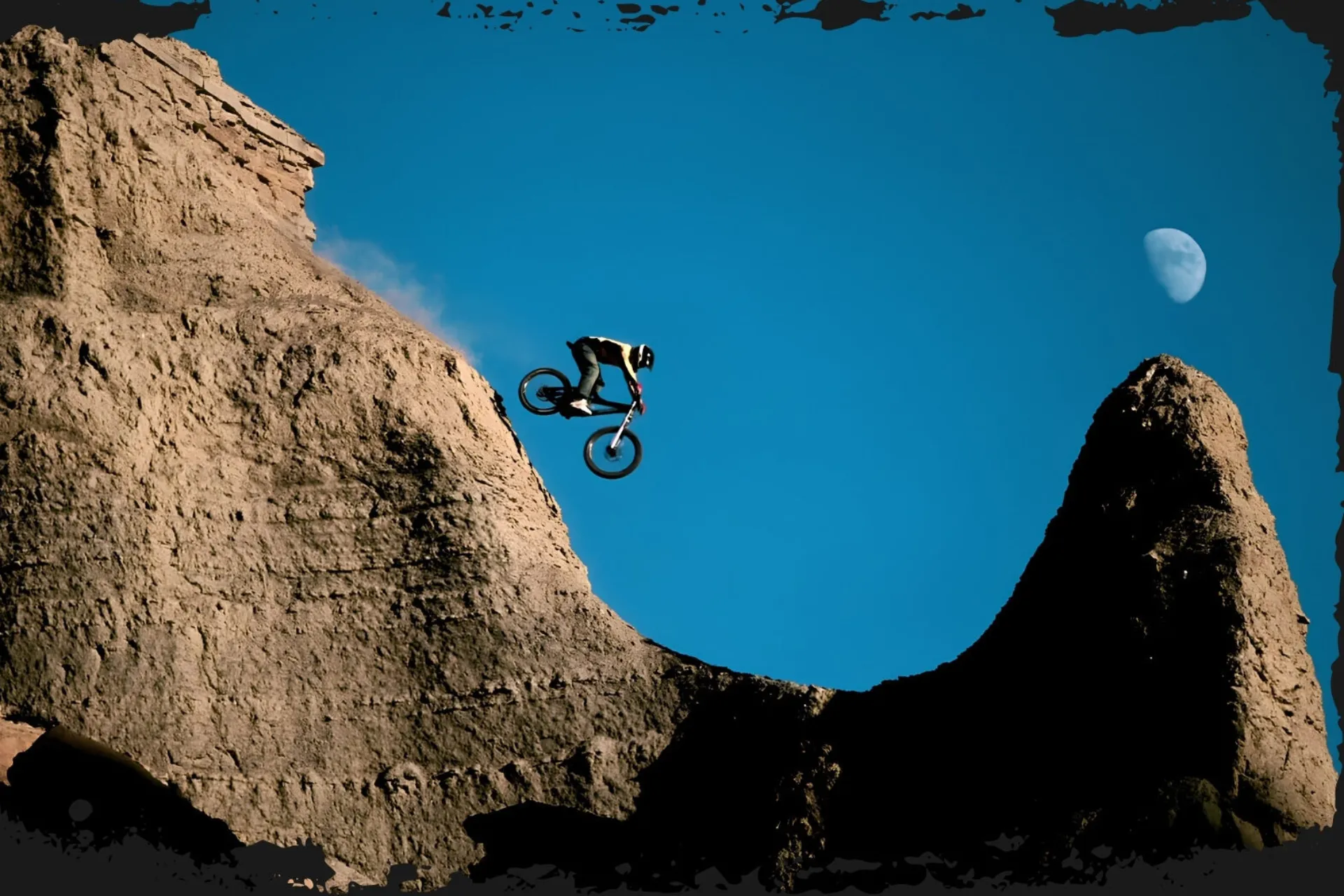 Darren Berrecloth drops in a utah freeride line with the moon in the background. From the Collective. Photo: Sterling Lorence