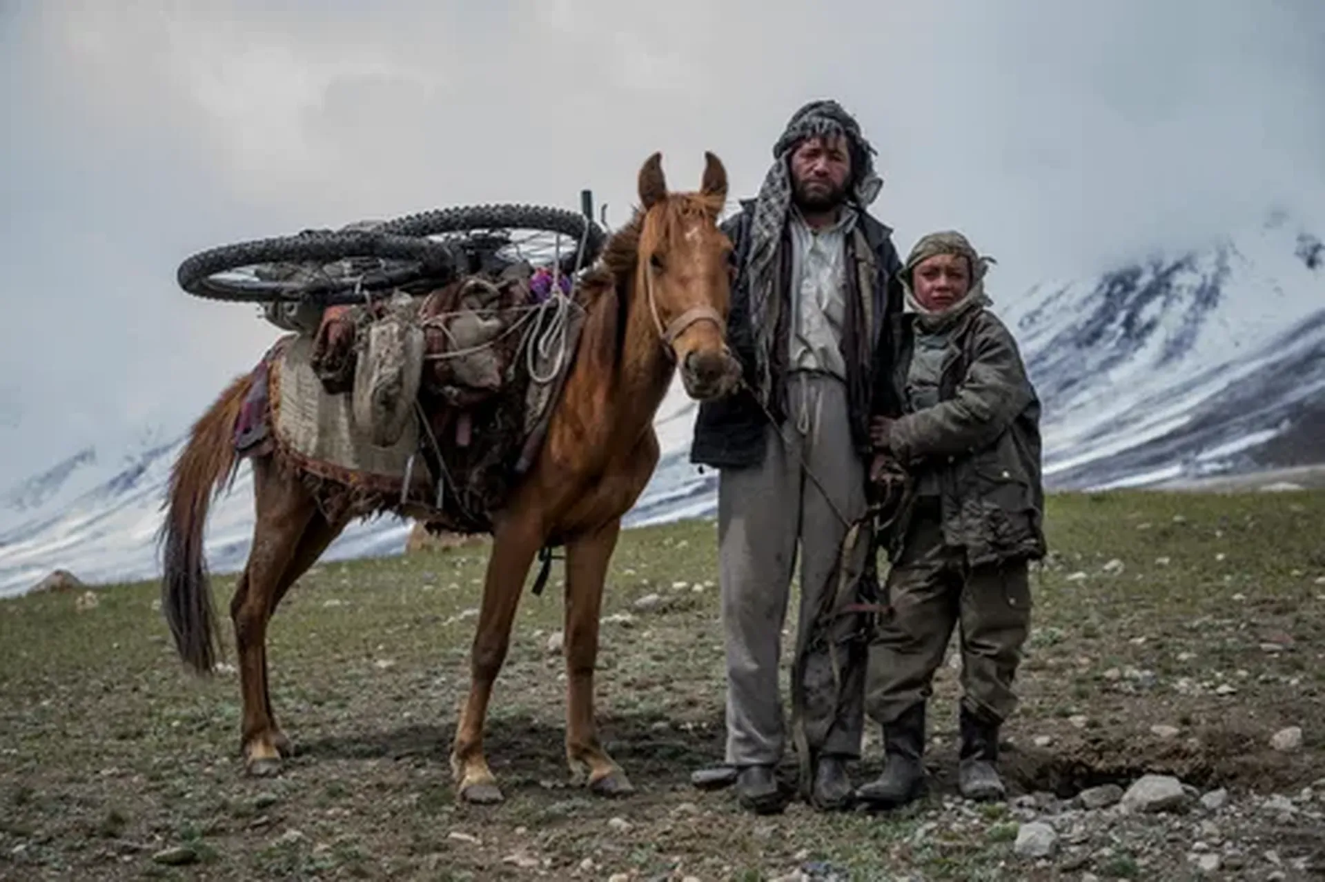 2 men and a horse in the mountains of Afghanistan whilst filming Forgotten Dirt